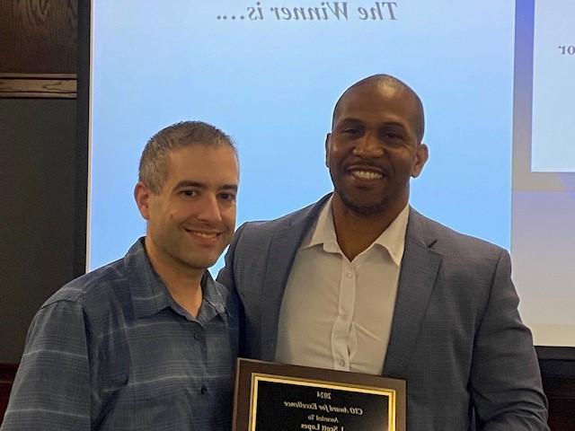 CIO Daryl Ford posing with CIO Award winner Scott Lopes